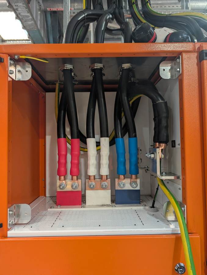 Mains cable termination at an industrial site